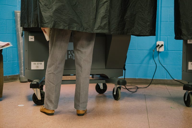 A voter casts a ballot at a polling location in Philadelphia on May 17, 2022.