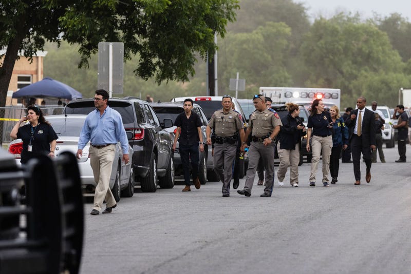 : Law enforcement work the scene after a mass shooting at Robb Elementary School where 19 people, including 18 children, were killed on May 24, 2022 in Uvalde, Texas. The suspected gunman, identified as 18-year-old Salvador Ramos, was reportedly killed by law enforcement. (Photo by Jordan Vonderhaar/Getty Images)