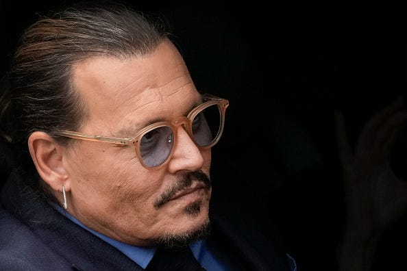 Actor Johnny Depp sits in his vehicle as he departs the Fairfax County Courthouse on May 27, 2022 in Fairfax, Virginia. Closing arguments in the Depp v. Heard defamation trial, brought by Johnny Depp against his ex-wife Amber Heard, concluded today and jury deliberations begin.