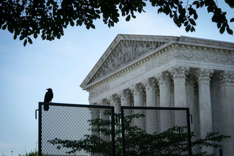 A bird sits atop security fencing outside of the U.S. Supreme Court on May 31, 2022 in Washington, DC. According to media reports, Supreme Court officials are escalating their search for the source of the leaked draft opinion that would overturn Roe v. Wade. The justices have 33 remaining cases to be decided by the end of June or the first week in July. The issues include abortion, guns, religion and climate change. (Photo by Drew Angerer/Getty Images)