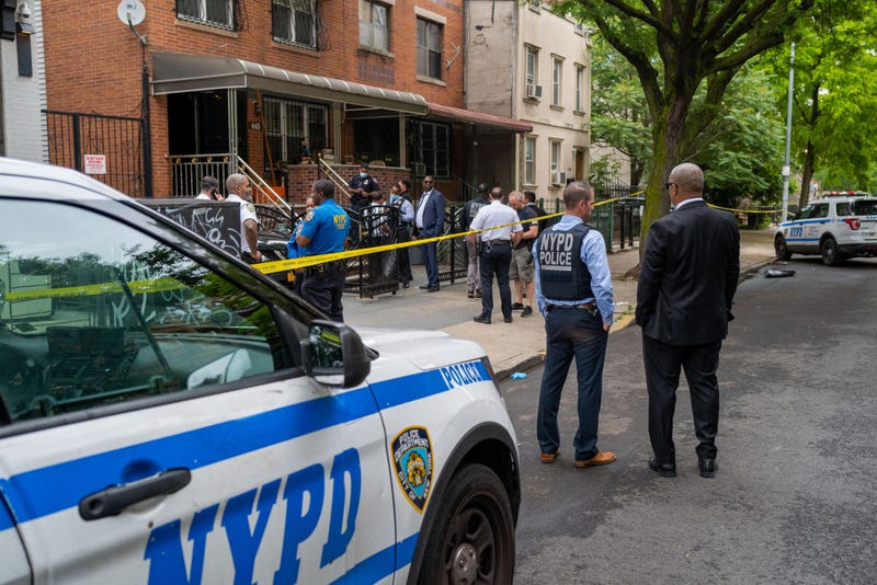 Police gather at the scene of a shooting in Brooklyn that left one person dead on June 16, 2022, in New York City.