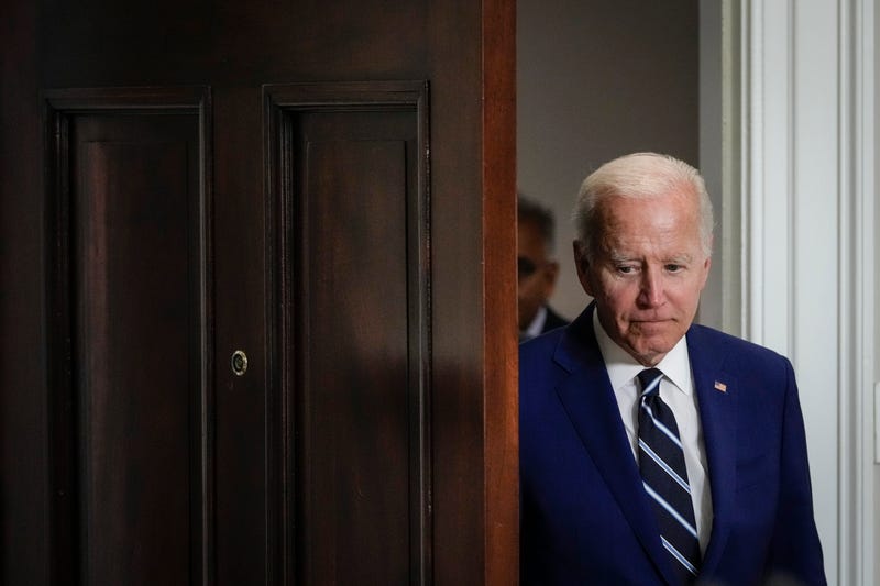 President Biden going through a door