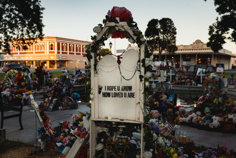 A sign reads "I hope u know how loved u are" at a memorial for the victims of the mass shooting at Robb Elementary School on June 25, 2022 in Uvalde, Texas.