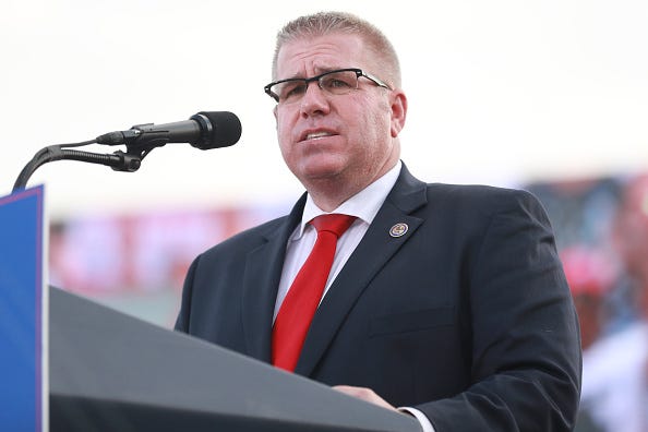 Illinois Gubernatorial hopeful Darren Bailey delivers remarks after receiving an endorsement from Donald Trump during a Save America Rally with former US President Donald Trump at the Adams County Fairgrounds on June 25, 2022 in Mendon, Illinois.