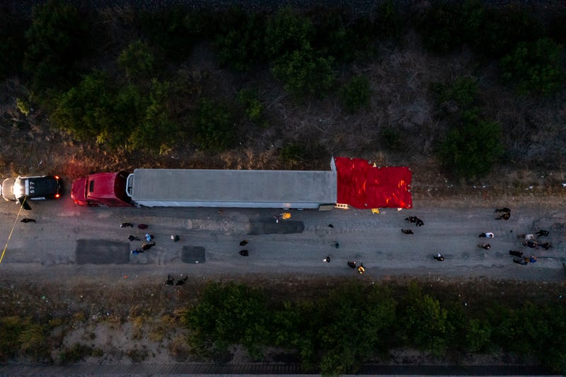 In this aerial view, members of law enforcement investigate a tractor trailer on June 27, 2022 in San Antonio, Texas.