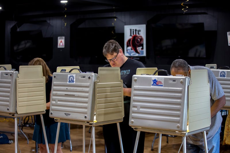 Voters fill out their ballots at a polling place in Chicago.