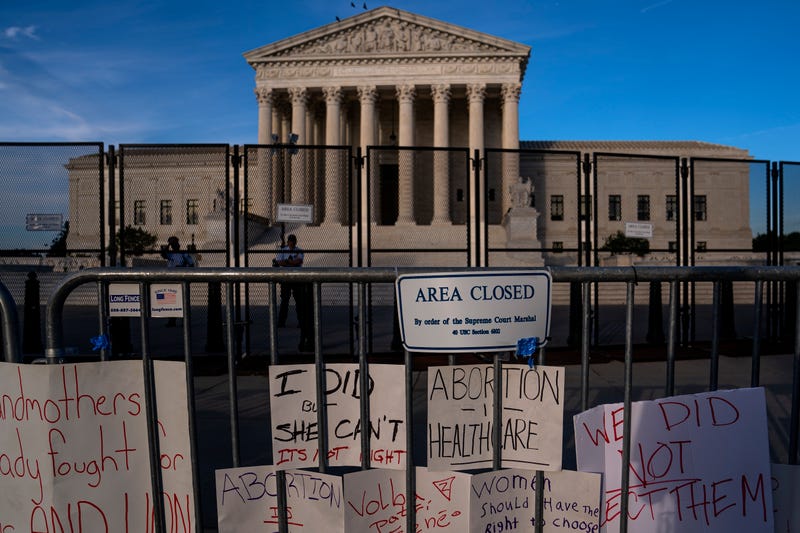 Signs left by abortion-rights supporters line the security fence surrounding The Supreme Court on June 28, 2022 in Washington, D.C.