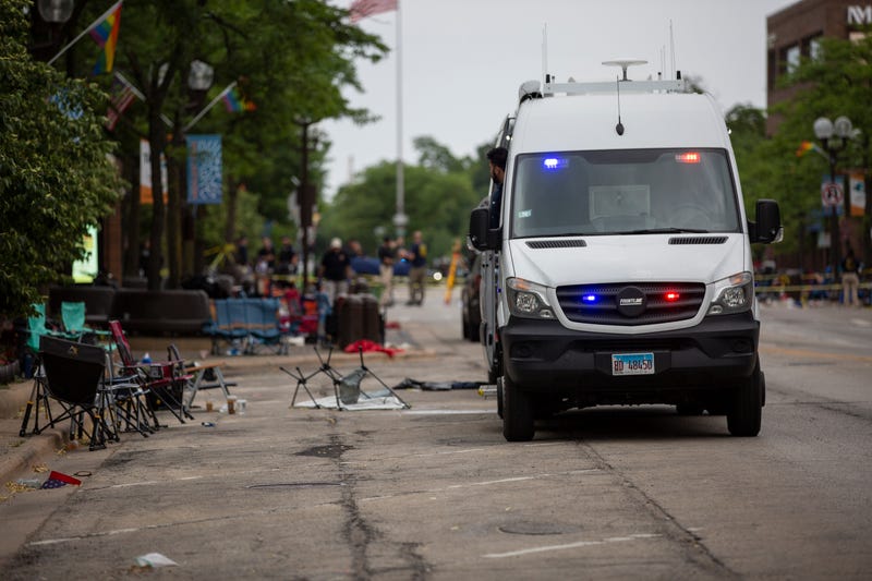 First responders work the scene of a mass shooting at a Fourth of July parade on July 4, 2022 in Highland Park, Illinois.