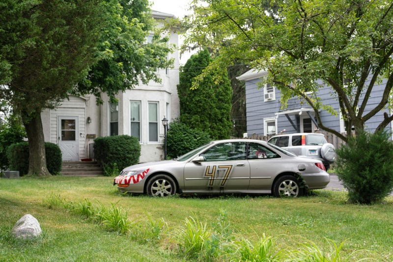 A car with decals is parked outside of the house where Robert Crimo III, lives in the Chicago suburb of Highwood, Illinois, on July 5, 2022. - Police arrested a suspect on July 4, 2022, after a mass shooting left six dead at a US Independence Day parade in Highland Park. Robert Crimo, 21, was identified as a "person of interest" and became the target of a massive manhunt across the town, where a rooftop gunman with a high-powered rifle turned a family-focused July 4 parade celebration into a scene of death and trauma.