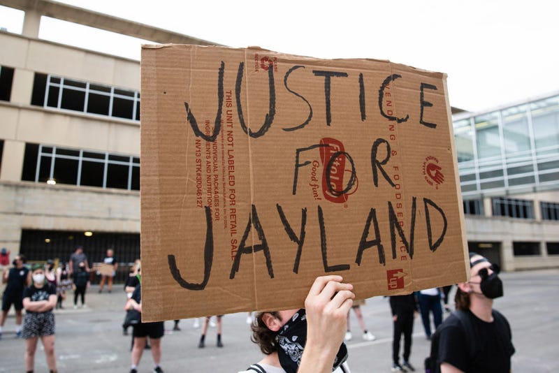 A protester holds a sign that says, "Justice for Jayland Walker" during the demonstration. Hundreds of protesters gather to call for justice in the police killing of Jayland Walker. Due to this protest, Mayor Dan Horrigan declared a state of emergency and canceled the Fourth of July fireworks.