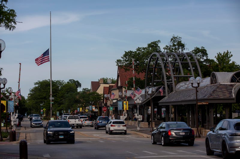 Highland Park central business district, with a U.S. flag flying at half mast