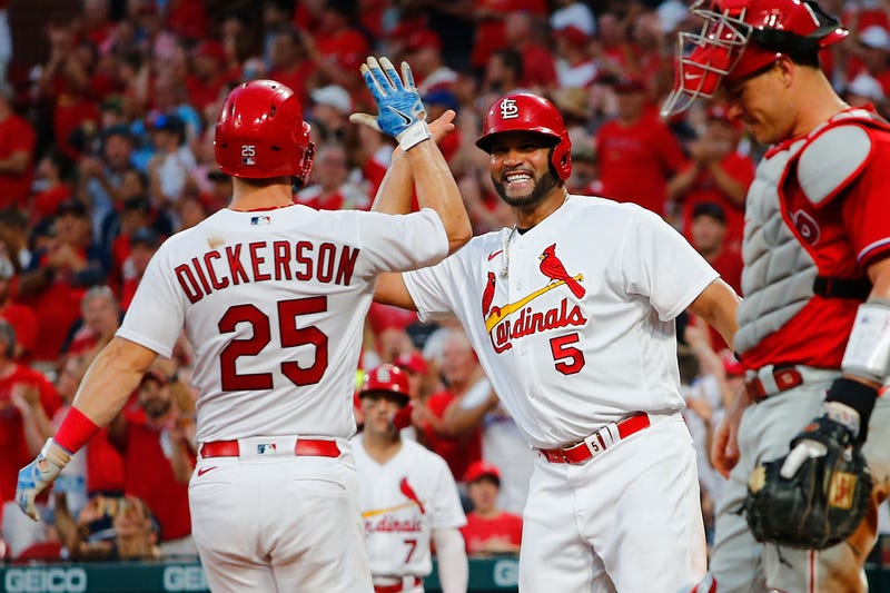 Albert Pujols high-fiving Dickerson
