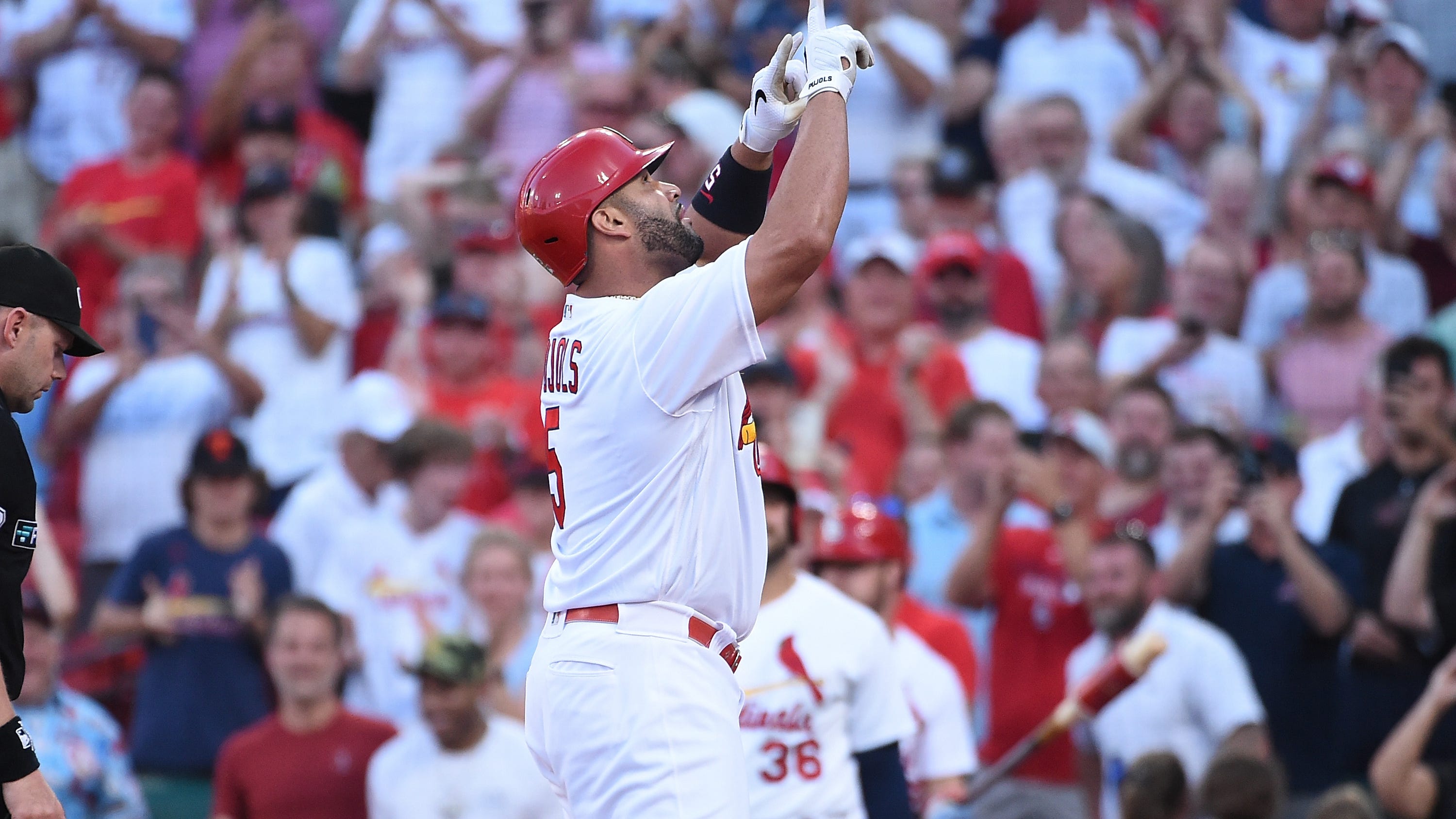 Albert Pujols high-fives Nelly after home run against Dodgers
