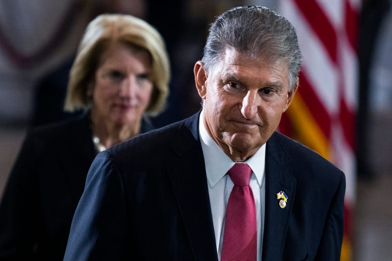Sen. Joe Manchin, D-W.Va., and Sen. Shelley Moore Capito, R-W.Va., pay respects to Hershel Woodrow Woody Williams in the United States Capitol Rotunda during a Congressional tribute ceremony on July 14, 2022 in Washington, D.C.