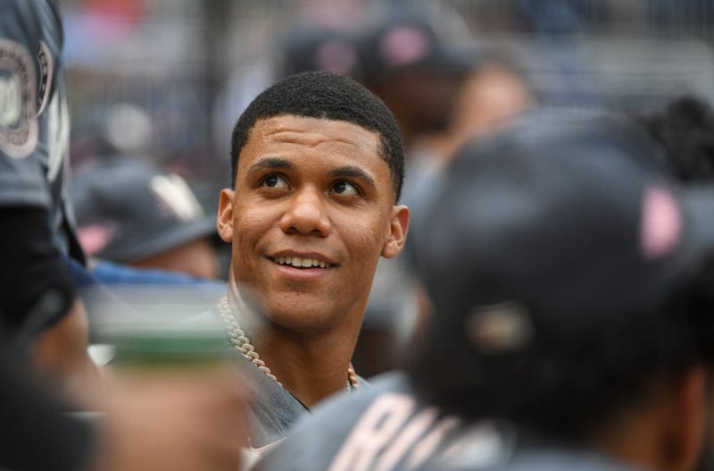 Washington Nationals right fielder Juan Soto (22) talks with his teammates in the dugout during action against the Atlanta Braves at Nationals Park.