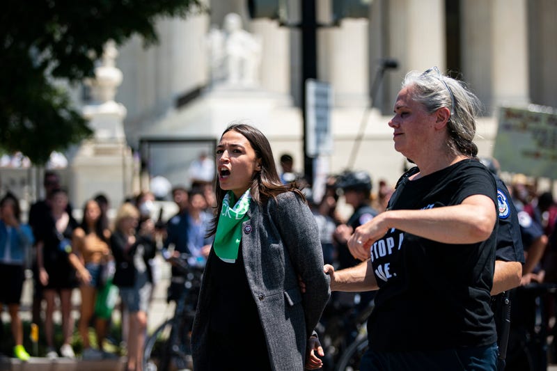 Representative Alexandria Ocasio-Cortez, a Democrat from New York, is arrested outside the US Supreme Court during a protest of the court overturning Roe v. Wade in Washington, D.C., US, on Tuesday, July 19, 2022