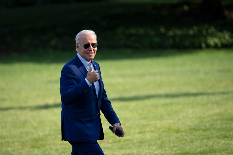 WASHINGTON, DC - JULY 20: U.S. President Joe Biden gestures toward reporters as he departs Marine One and walks to the Oval Office on the South Lawn of the White House July 20, 2022 in Washington, DC. Biden traveled to Somerset, Massachusetts to discuss his next steps on addressing climate change. He delivered remarks at the site of the now-closed Brayton Point power plant, which is being turned into the states first offshore wind manufacturing facility.