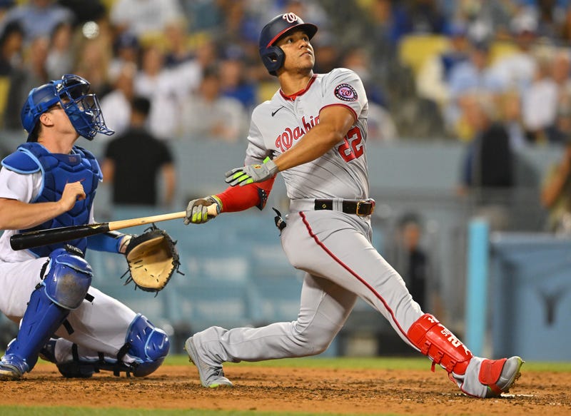 Juan Soto #22 of the Washington Nationals pops out to Gavin Lux #9 of the Los Angeles Dodgers in the fifth inning at Dodger Stadium on July 26, 2022 in Los Angeles, California.