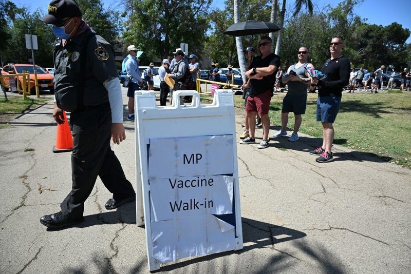 People wait in line to receive the monkeypox vaccine at the Balboa Sports Center in the Encino neighborhood of Los Angeles on July 27, 2022.
