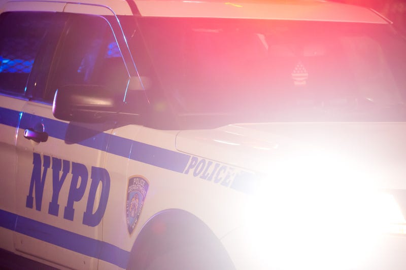 An NYPD vehicle arrives at the scene of a shooting in Crown Heights