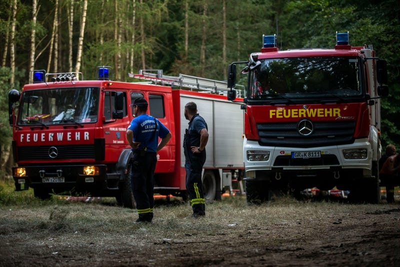 BAD SCHANDAU, Germany - AUGUST 02: Firefighters work during the operation in order to extinguish fires as it continues to burn in forests of Saxony Switzerland on August 02, 2022 near Bad Schandau, Saxony, Germany. The fire broke out on July 24th and started spreading as the wind rose, it has spread out in Bohemian Switzerland, National Park, Czech Republic as well as Saxony Switzerland in Germany.
