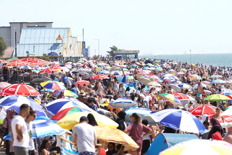 People gather in the hot weather at Southend-on-Sea beach. A drought has been declared for parts of England following the driest summer for 50 years.