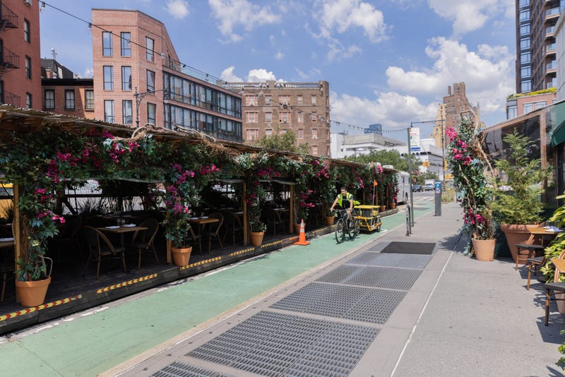An outdoor dining area for the Baby Brasa restaurant in New York