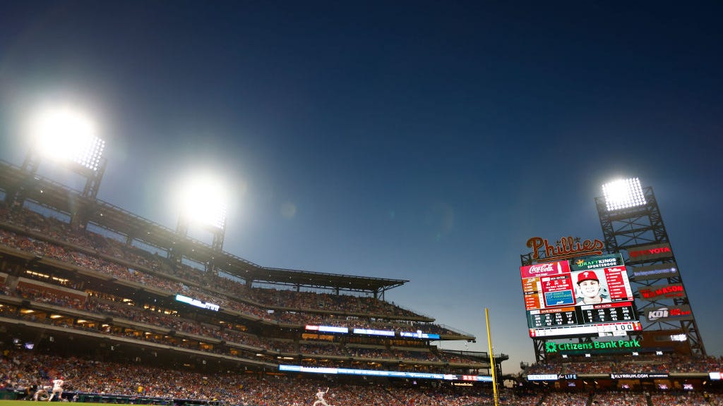How did a Mets fan throw the first pitch at a Phillies home game? All it takes is enough tickets