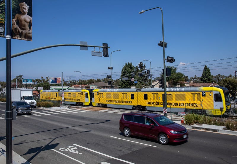 A metro train, traveling on the new K Line, makes its way along Crenshaw Blvd. in Los Angeles during a test run.