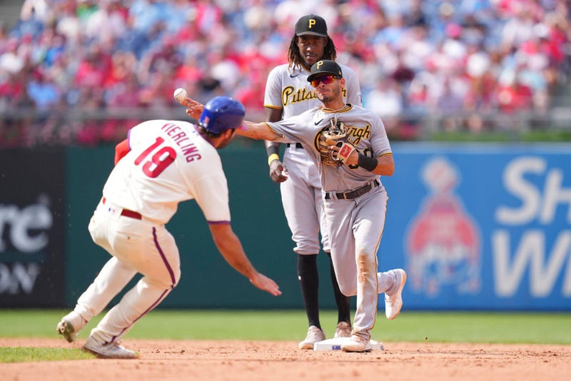 Tucupita Marcano, #30 of the Pittsburgh Pirates, turns a double play against Matt Vierling, #19 of the Philadelphia Phillies, in the bottom of the seventh inning at Citizens Bank Park on Aug. 28, 2022, in Philadelphia, Pennsylvania. The Pirates defeated the Phillies 5-0.