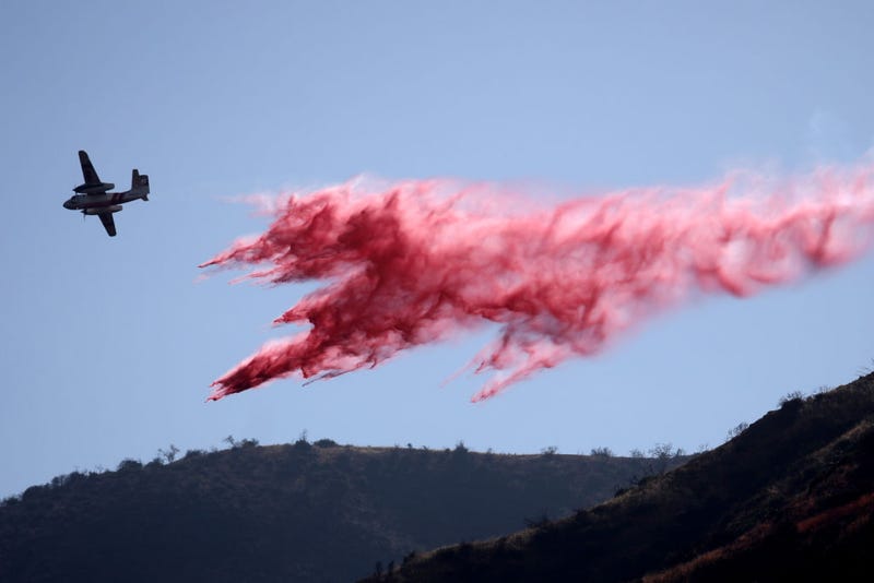 AUGUST 29: Fire crews work to contain a brush fire burning near Mile Marker 21 along San Gabriel Canyon Road near the San Gabriel Dam. According to the Angeles National Forest, the Gulch Fire burned up to 100 acres Monday in the San Gabriel Mountains.