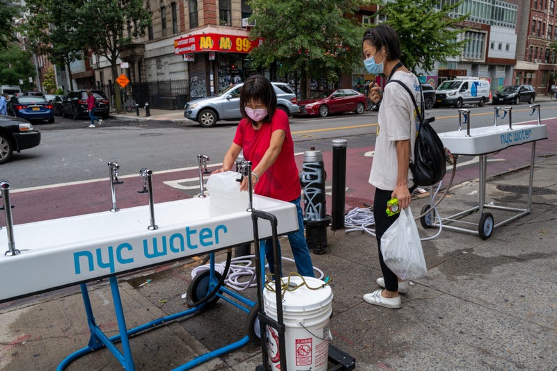Portable water stations are set up outside of the Jacob Riis Houses on September 07, 2022 in New York City. Following the discovery of dangerous levels of arsenic in the tap water at the New York City housing complex in the East Village, residents have been given bottled water and provided with water stations. More than 2,500 people who are living at the complex have been told not to drink or cook with water from their taps.