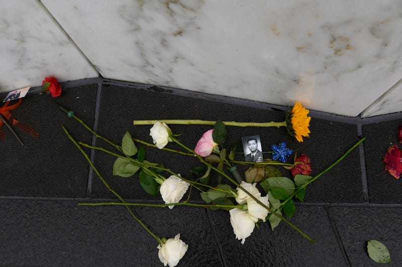A photo of First Officer Leroy Homer with flowers at his stone at the Wall of Names at the Flight 93 National Memorial during a ceremony commemorating the 21st anniversary of the crash of Flight 93 during the September 11th terrorist attacks on September 11, 2022 in Shanksville, Pennsylvania.
