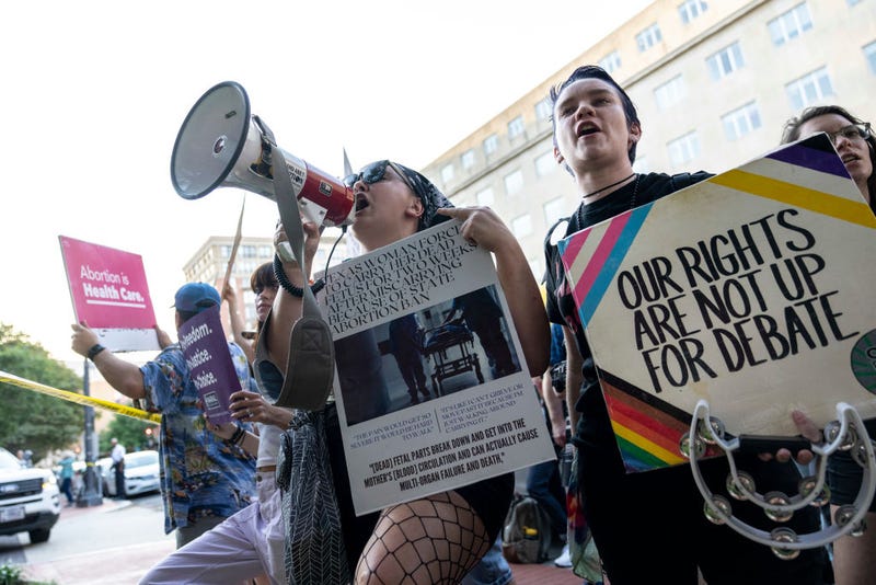 Abortion rights activists protest as guests arrive for the Susan B. Anthony Pro-Life Americas annual gala and fundraising dinner at the National Building Museum on September 13, 2022 in Washington, DC. Earlier in the day, Sen. Lindsey Graham (R-SC) introduced legislation that would institute a federal ban on abortions after 15 weeks of pregnancy. (Photo by Drew Angerer/Getty Images)