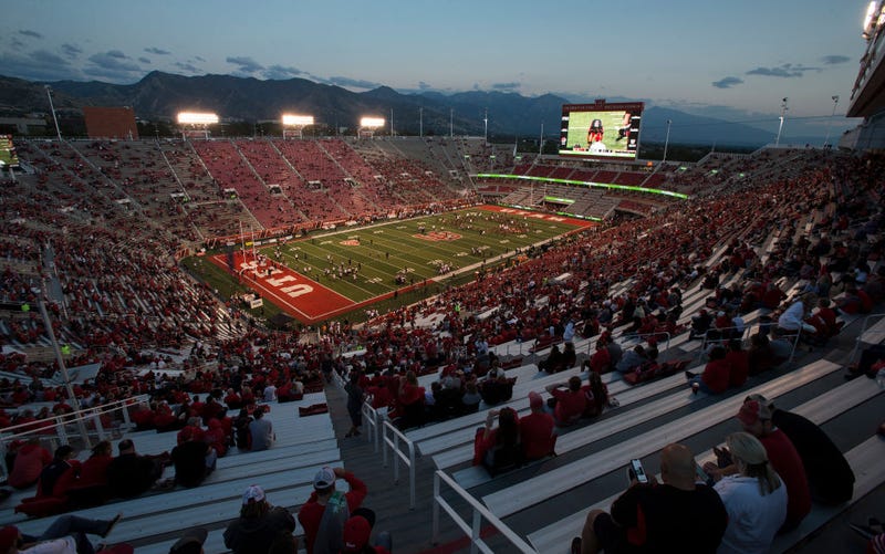 Fans watch as members of the Utah Utes and the San Diego State Aztecs warm up before their game September 17, 2022 at Rice Eccles Stadium in Salt Lake City, Utah.