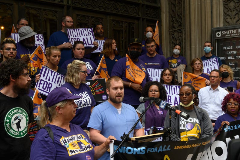 Joel Gundy, a nurse for UPMC in Pittsburgh speaks at a rally