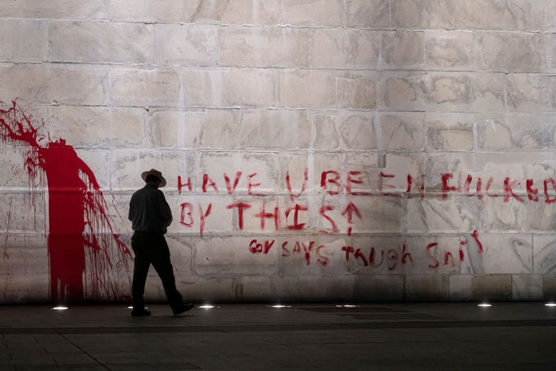  The U.S. Park Police guard the Washington Monument after a vandal wrote graffiti and threw red paint against the base of the structure on September 21, 2022 in Washington, DC.
