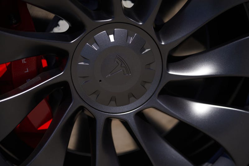 A Tesla logo is seen on a wheel in a parking lot on September 22, 2022 in Santa Monica, California.