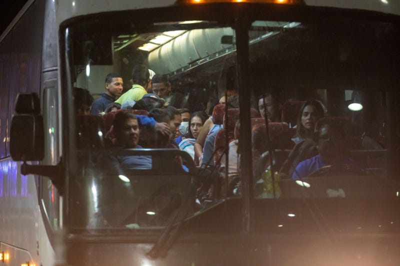 Migrants arrive at the Port Authority bus terminal in New York on Sept. 27, 2022.