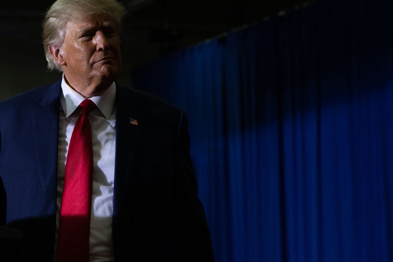 Former President Donald Trump looks over at the crowd as he speaks during a Save America rally on October 1, 2022 in Warren, Michigan. Trump has endorsed Republican gubernatorial candidate Tudor Dixon, Secretary of State candidate Kristina Karamo, Attorney General candidate Matthew DePerno, and Republican businessman John James ahead of the November midterm election. (Photo by Emily Elconin/Getty Images)