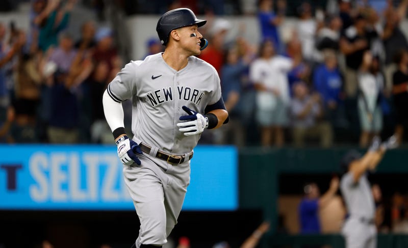 Aaron Judge #99 of the New York Yankees rounds the bases after hitting his 62nd home run of the season against the Texas Rangers during the first inning in game two of a doubleheader at Globe Life Field on Oct. 4, 2022, in Arlington, Texas. Judge has now set the American League record for home runs in a single season. 