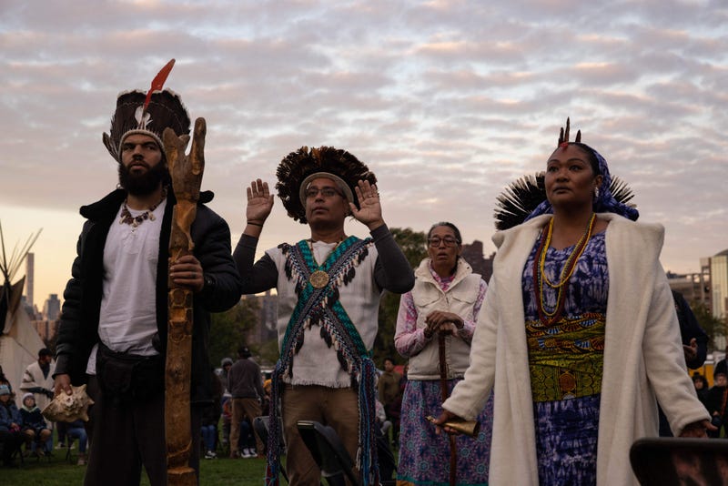 People gather on Randall's Island in New York City on October 10, 2022, to participate in an Indigenous Peoples' Day sunrise ceremony.