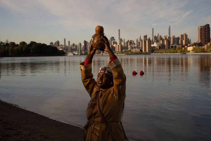 Chenae Bullock, of The Shinnecock Indian Nation, holds a traditional container of water during an Indigenous Peoples' Day sunrise ceremony on Randall's Island in New York City on October 10, 2022.
