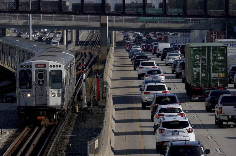 A CTA Red Line train approaches the 95th Street station as heavy traffic travels along the Dan Ryan Expressway toward the Loop on Aug. 30, 2022.