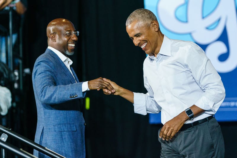 Former President Barack Obama greets Sen. Raphael Warnock (D-GA) as he arrives at a campaign event for Georgia Democrats on October 28, 2022 in College Park, Georgia. Obama is in Georgia in support of Democratic candidates, encouraging voters to turn out. (Photo by Elijah Nouvelage/Getty Images)
