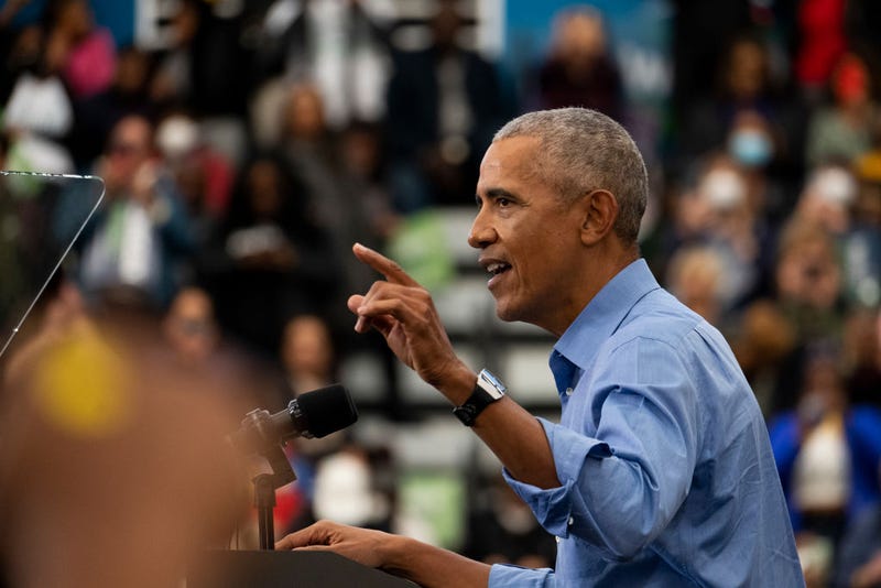 Former US President Barack Obama speaks to a crowd at Renaissance High School during a campaign rally for Michigan Democrats 