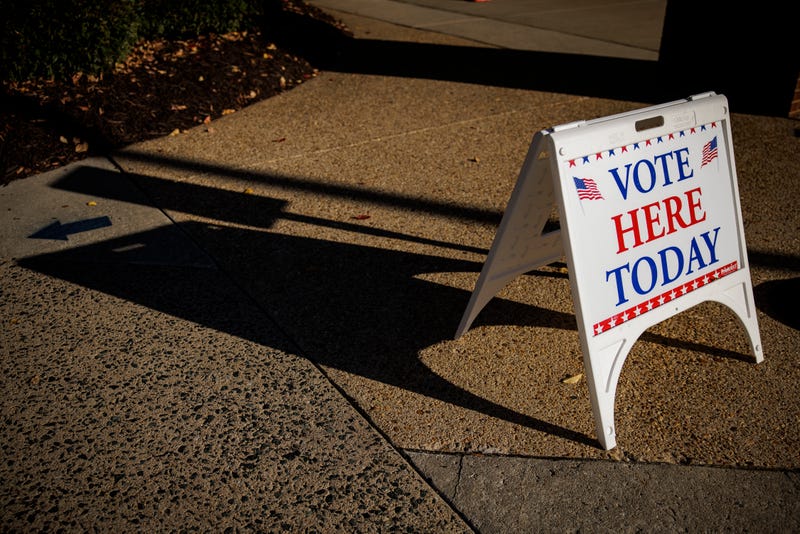 "vote here today" sign