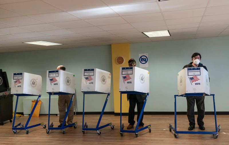 People are seen voting at a polling station in the Bronx on Election Day of Nov. 8, 2022