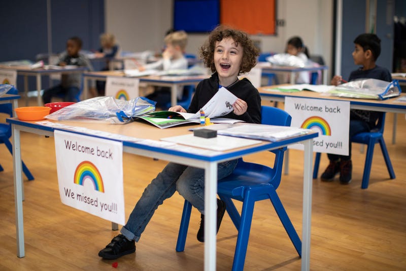 Children sit at individual desks during a lesson at the Harris Academy's Shortland's school on June 04, 2020 in London, England.