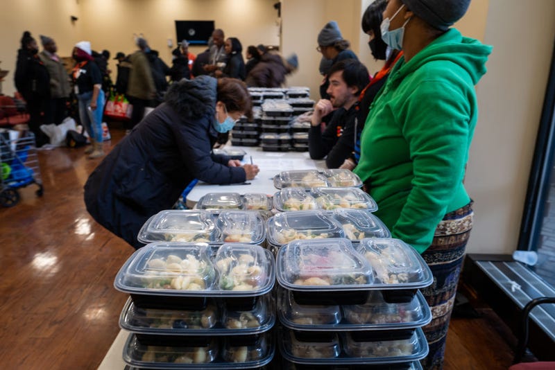 People receive free turkeys and other Thanksgiving oriented food at a community Thanksgiving food drive in Brooklyn to those in need on November 16, 2022 in New York City. The events, which was hosted by local politicians, businesses and charities, gave away over 1000 turkeys, chicken dinners and groceries. As food prices continue to rise across the country due to inflation, millions of Americans are struggling to afford groceries this holiday season.(Photo by Spencer Platt/Getty Images)
